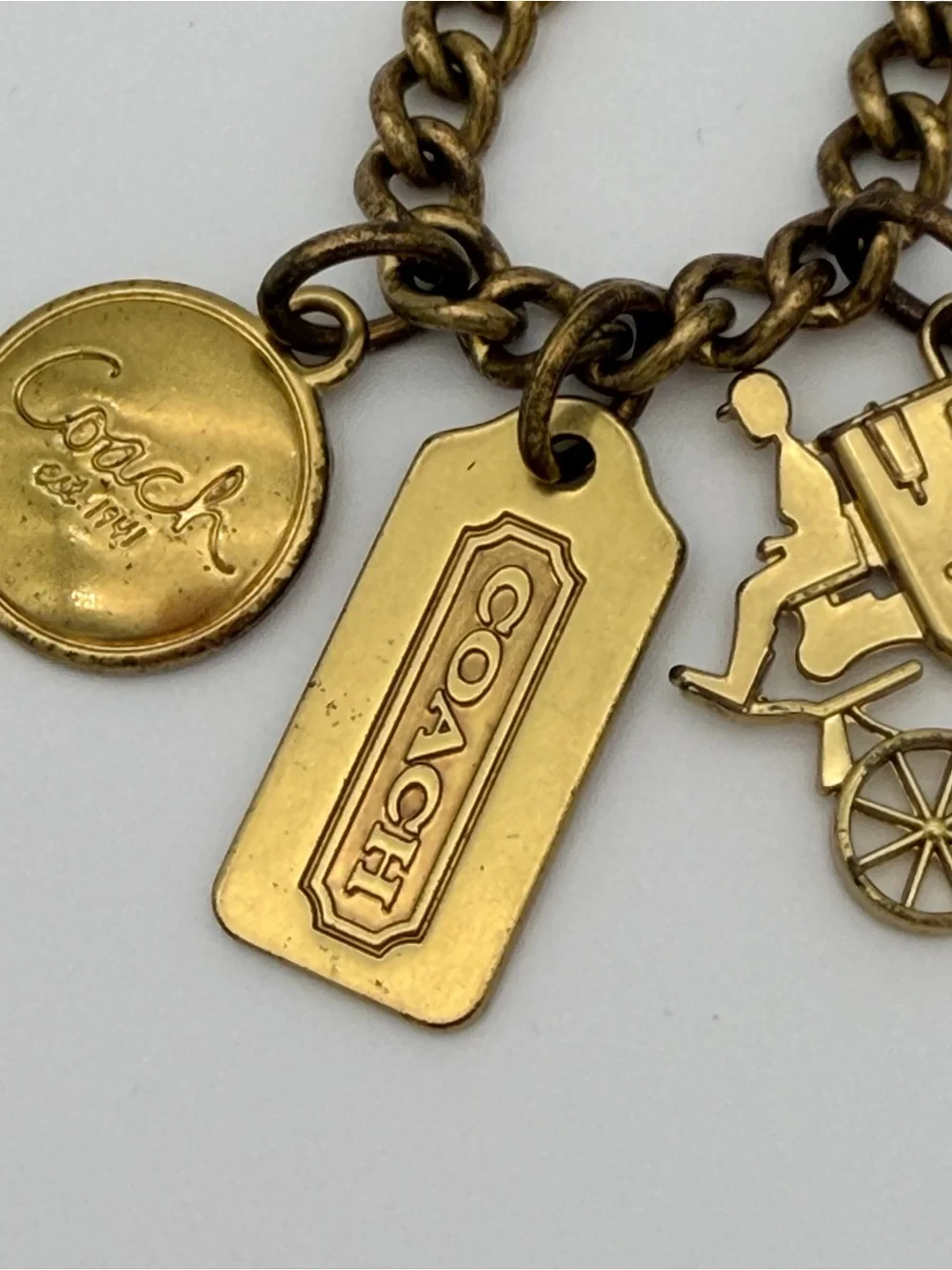 COACH Brass Charm Bracelet with Coach Tags & Horse Carriage Charm